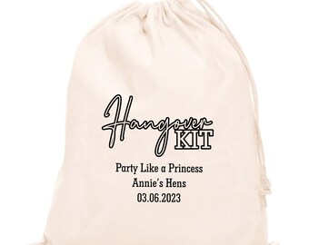 May include: A white cotton drawstring bag with the text "Hangover KIT" in black. Below the text is "Party Like a Princess Annie's Hens 03.06.2023".