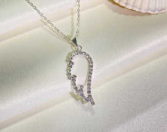 Collar de alas de ángel con cristales de imitación: colgante con dije bañado en plata