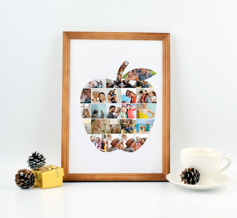 Op de afbeelding: Een ingelijst fotocollage van een familie in de vorm van een appel. De collage is gemaakt van veel kleinere foto's van verschillende mensen, die allemaal glimlachen en er gelukkig uitzien. De lijst is van lichtbruin hout.