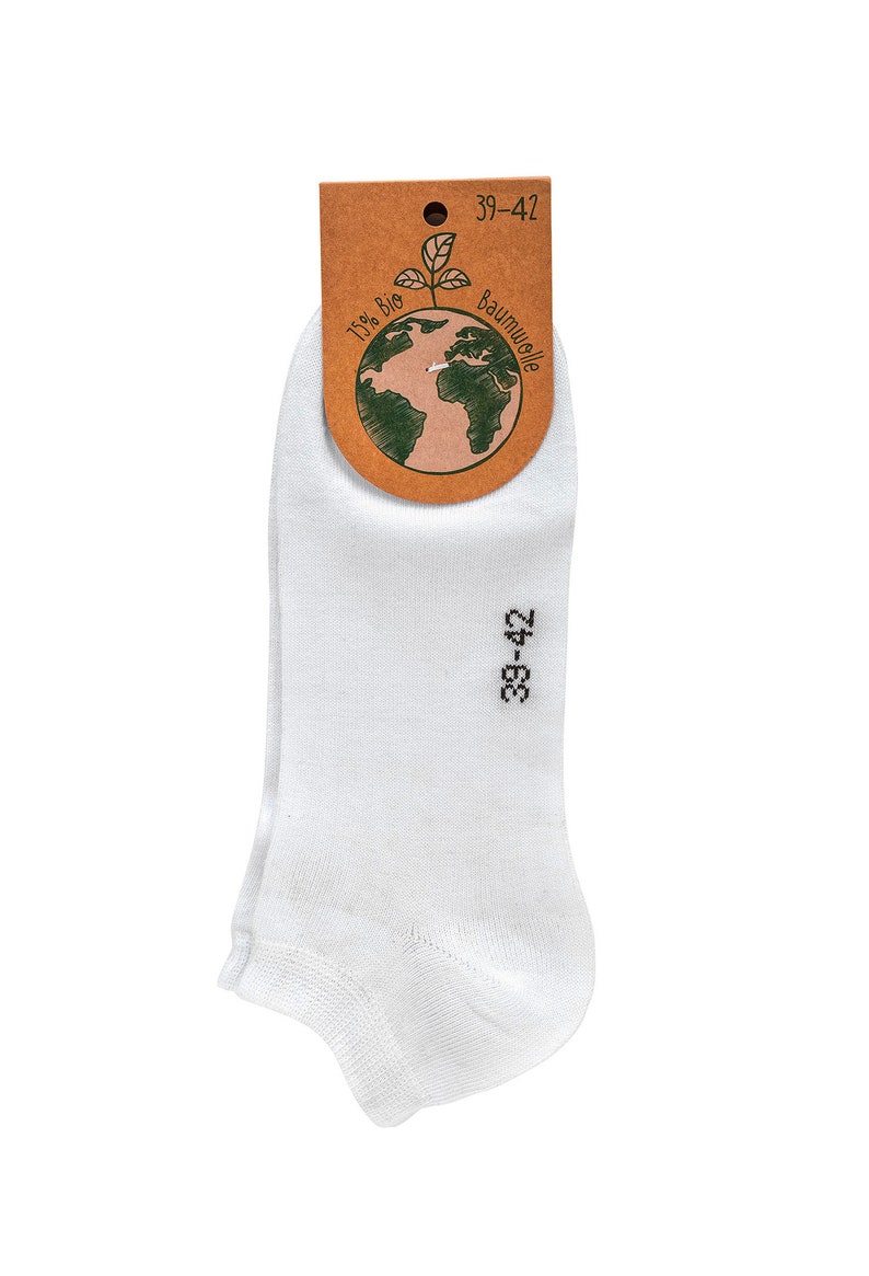 May include: White ankle socks with a brown tag that says "100% Bio Baumwolle" and "39-42". The tag has a green drawing of the Earth with a plant growing out of it.