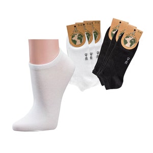 May include: A pair of white ankle socks with a pair of black ankle socks. The socks are packaged with a label that says "39-42" and "27-28".