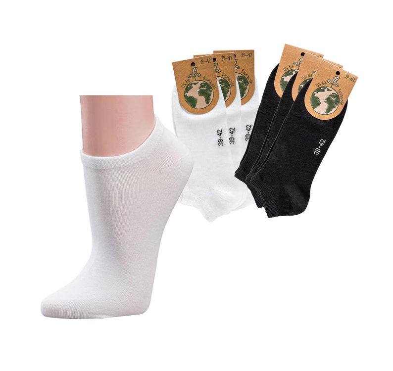 May include: A pair of white ankle socks with a pair of black ankle socks. The socks are packaged with a label that says "39-42" and "27-28".