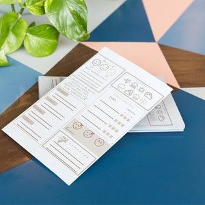 May include: A white printable planner with a brown and white design. The planner has sections for "Mood", "Gratitude", "To-Do List", "Weather", and "Time".