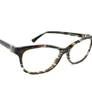 Puede incluir: Gafas de vista de carey marrón y negro con montura de ojo de gato.