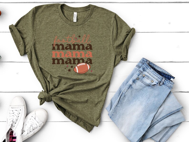 May include: A green t-shirt with the text "football mama mama mama" and a football graphic.