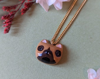 Collier orné d'une tete de bouledogue en fimo, bijou un peu kitsch pour les amoureux des chiens