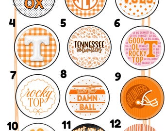 May include: A collection of twelve circular buttons featuring orange and white designs. Graphics include text like KNOX, VOLS, TENNESSEE VOLUNTEERS, ROCKY TOP, RUN THE DAMN BALL, GO VOLS, and MEET YOU AT NEYLAND STADIUM, alongside patterns, a football helmet, and a dog illustration.