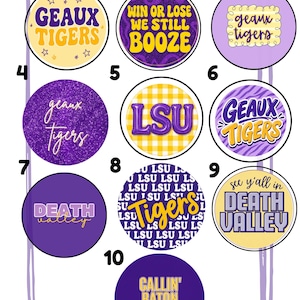 May include: A collection of ten circular stickers featuring purple and gold designs with text including Geaux Tigers, Win Or Lose We Still Booze, LSU, Death Valley, and Callin' Baton Rouge. The graphics incorporate various patterns like gingham, glitter, and zebra stripes.