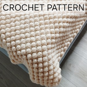 Patrón de manta de bebé de ganchillo con pompones