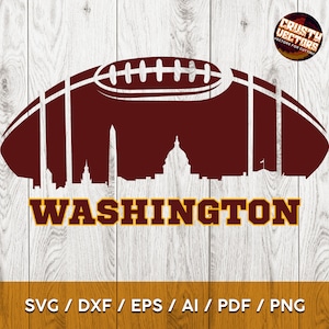 May include: A maroon football with a white outline and a white silhouette of the Washington D.C. skyline, including the Washington Monument, inside the football. The text "WASHINGTON" is below the football in gold letters.