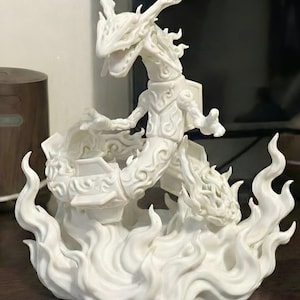 May include: A white sculpture of a serpentine dragon with intricate details. The dragon has a long, winding body and is surrounded by stylized flames. The sculpture is made of a solid white material and is likely a decorative item or collectible.