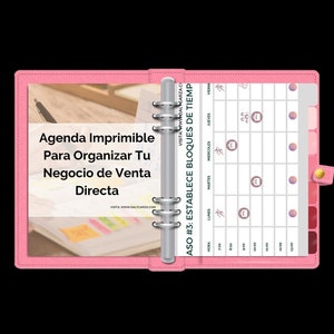 May include: A pink binder with a printed planner page. The planner includes a weekly schedule with time slots and icons. The binder also has text that says "Agenda Imprimible Para Organizar Tu Negocio de Venta Directa".