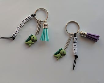 Llavero personalizado de dinosaurio verde: dije para bolso con cuentas y borla