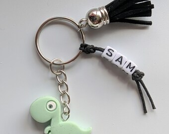 Llavero de dinosaurio personalizado: dije para bolso con cuentas y borla, llavero de dinosaurio verde