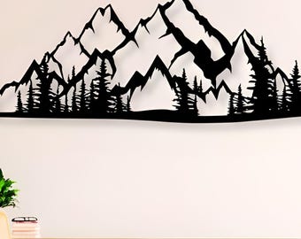 May include: A black metal wall art piece depicting a mountain range with detailed peaks and a forest silhouette at the base. The artwork is mounted on a white wall, creating a striking contrast. The piece adds a touch of nature-inspired decor.