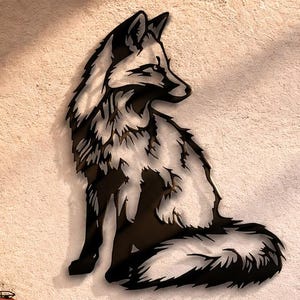 May include: A black and white metal fox wall art piece. The fox is depicted in a sitting position with its head turned to the side. The artwork is mounted on a textured, off-white wall. The room also features a wooden chair, a wooden console, and decorative lighting.
