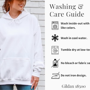 May include: A white hooded sweatshirt with a front pocket. The image includes a washing and care guide with instructions: wash inside-out with like colors, wash in cool water, tumble dry at low-temp, no bleach or fabric softeners, and do not iron design. The brand is Gildan 18500.