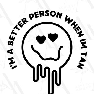 May include: Black and white graphic design with a smiley face with hearts for eyes and the text "I'm a better person when I'm tan".