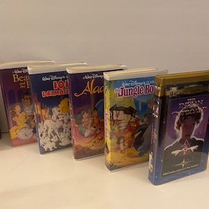 Vintage Kids VHS Tapes. Indian in the Cupboard, Beauty and the Beast,101 Dalmatians, Jungle book, and Aladdin