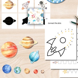 May include: A collection of watercolour illustrations featuring planets, a rocket, and an astronaut, set against a light wood background. A worksheet with a connect-the-dots rocket and the text "Connect the dots" is also visible. The theme is space and the solar system.