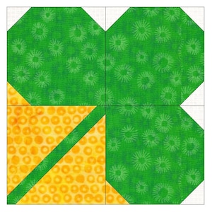 以下が含まれることがあります： 緑と黄色のパッチワークキルトブロックで、四つ葉のクローバーのデザインが施されています。クローバーの葉は、白い渦巻き模様の緑色の生地で作られています。ブロックの中心は、白いドット模様の黄色の生地で作られています。