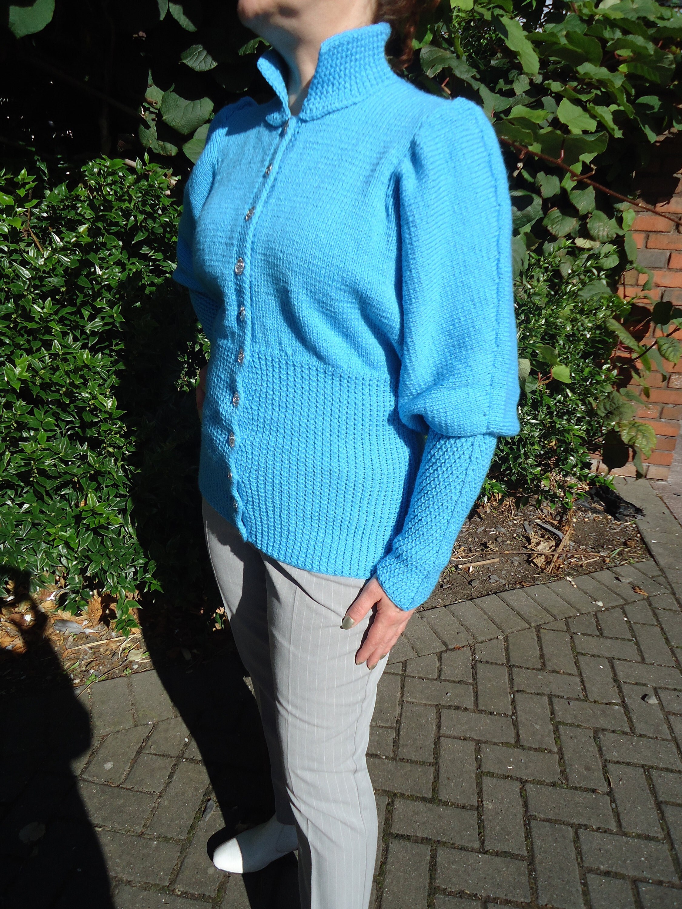 bright turquoise sweater