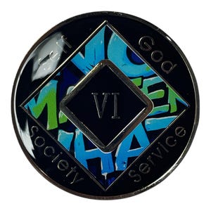 A black and silver coin with a blue, green, and white design. The coin has a black square in the center with the number 'VI' in white text. The coin has the words 'God', 'Self', 'Service', 'Society', around the outside of the coin.