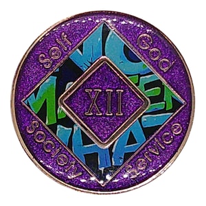 The reverse side of a sparkly purple recovery medallion showing the roman numeral XII and Self, God, Society, and Service.