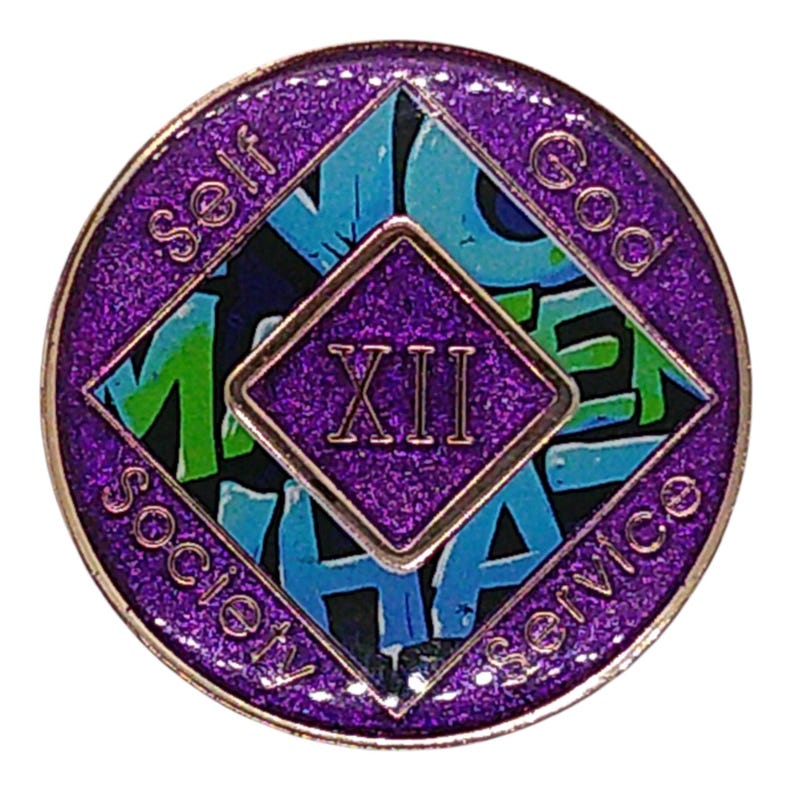 The reverse side of a sparkly purple recovery medallion showing the roman numeral XII and Self, God, Society, and Service.