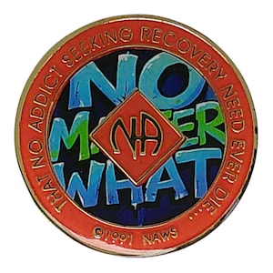 Front view of a bronze-toned recovery medallion featuring the text No Matter What surrounding a central red diamond with the NA symbol.