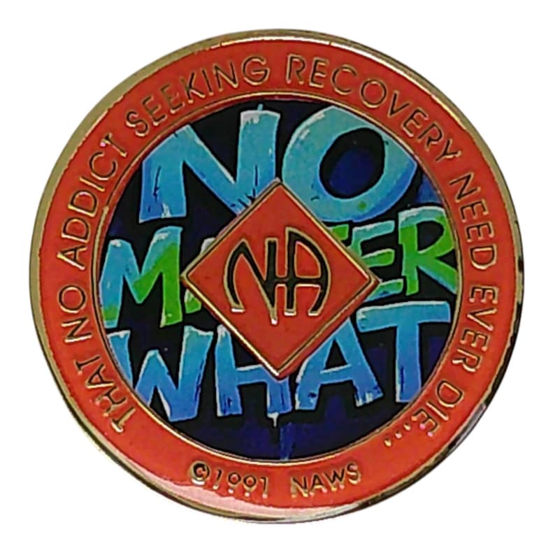 Front view of a bronze-toned recovery medallion featuring the text No Matter What surrounding a central red diamond with the NA symbol.