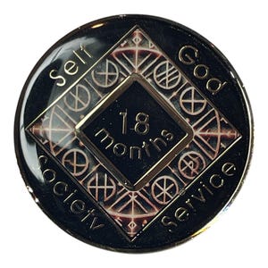 Narcotics Anonymous 18-month recovery medallion featuring a Norse rune-inspired geometric pattern in metallic bronze and black. The center diamond reads “18 months,” surrounded by the words “Self, God, Society, Service,” symbolizing unity, balance, and dedication to the recovery journey.