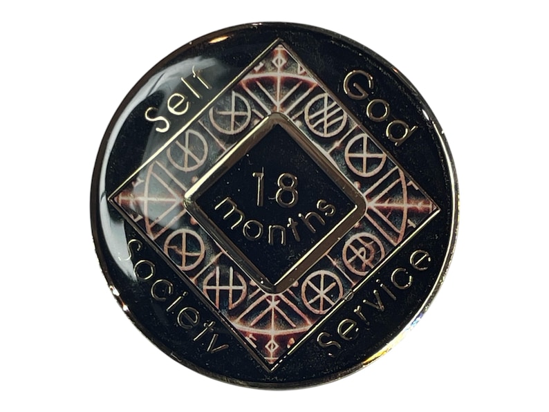 Narcotics Anonymous 18-month recovery medallion featuring a Norse rune-inspired geometric pattern in metallic bronze and black. The center diamond reads “18 months,” surrounded by the words “Self, God, Society, Service,” symbolizing unity, balance, and dedication to the recovery journey.