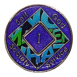 The reverse side of a purple recovery medallion showing the roman numeral I and Self, God, Society, and Service.