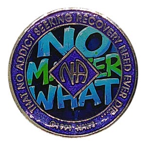 A sparkly purple recovery medallion featuring the text NO MATTER WHAT and the NA symbol.