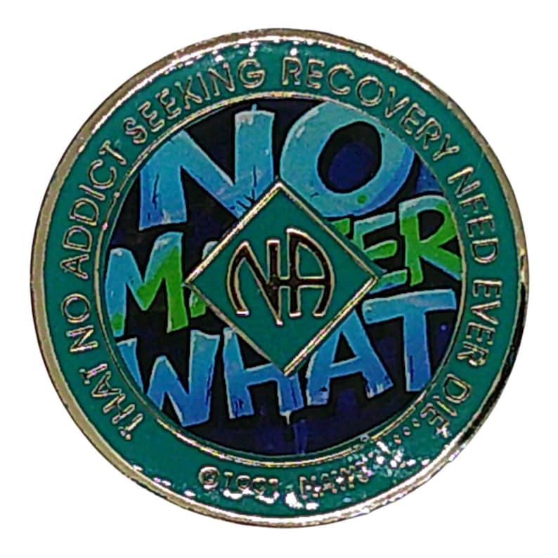 A teal recovery medallion featuring the text NO MATTER WHAT and the NA symbol.