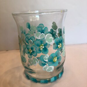 Hand Painted votive candle holder. Aqua and pale mint green flowers.