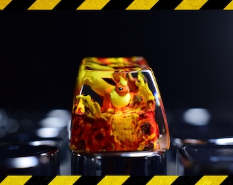 May include: A custom artisan keycap featuring a Flareon figure set within a clear resin block. The keycap has a fiery orange and yellow color scheme, with the Flareon figure in the center. The keycap is designed for mechanical keyboards.
