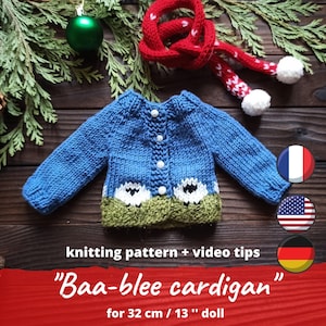 May include: Knitting pattern for a blue cardigan with a sheep design, for a 13 inch doll. The pattern includes video tips and is available in French, English, and German.