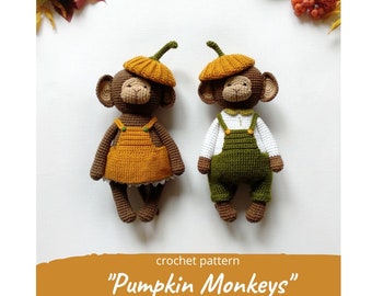 May include: Two crocheted monkey toys wearing pumpkin hats and overalls. The monkey on the left is wearing a yellow and orange outfit, while the monkey on the right is wearing a green outfit. The crochet pattern is titled "Pumpkin Monkeys".