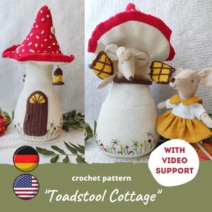 May include: Crochet pattern for a toadstool cottage with a red and white mushroom roof and a white crocheted base. The cottage is decorated with a brown door and yellow windows. The pattern includes video support.