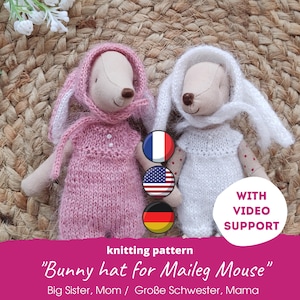 May include: Two stuffed Maileg mice wearing knitted bunny hats and dresses. One mouse is in pink, the other in white. The image includes text that reads "Bunny hat for Maileg Mouse" and "With Video Support."