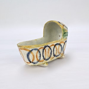 Antique English Figural Staffordshire or Prattware Pottery Cradle