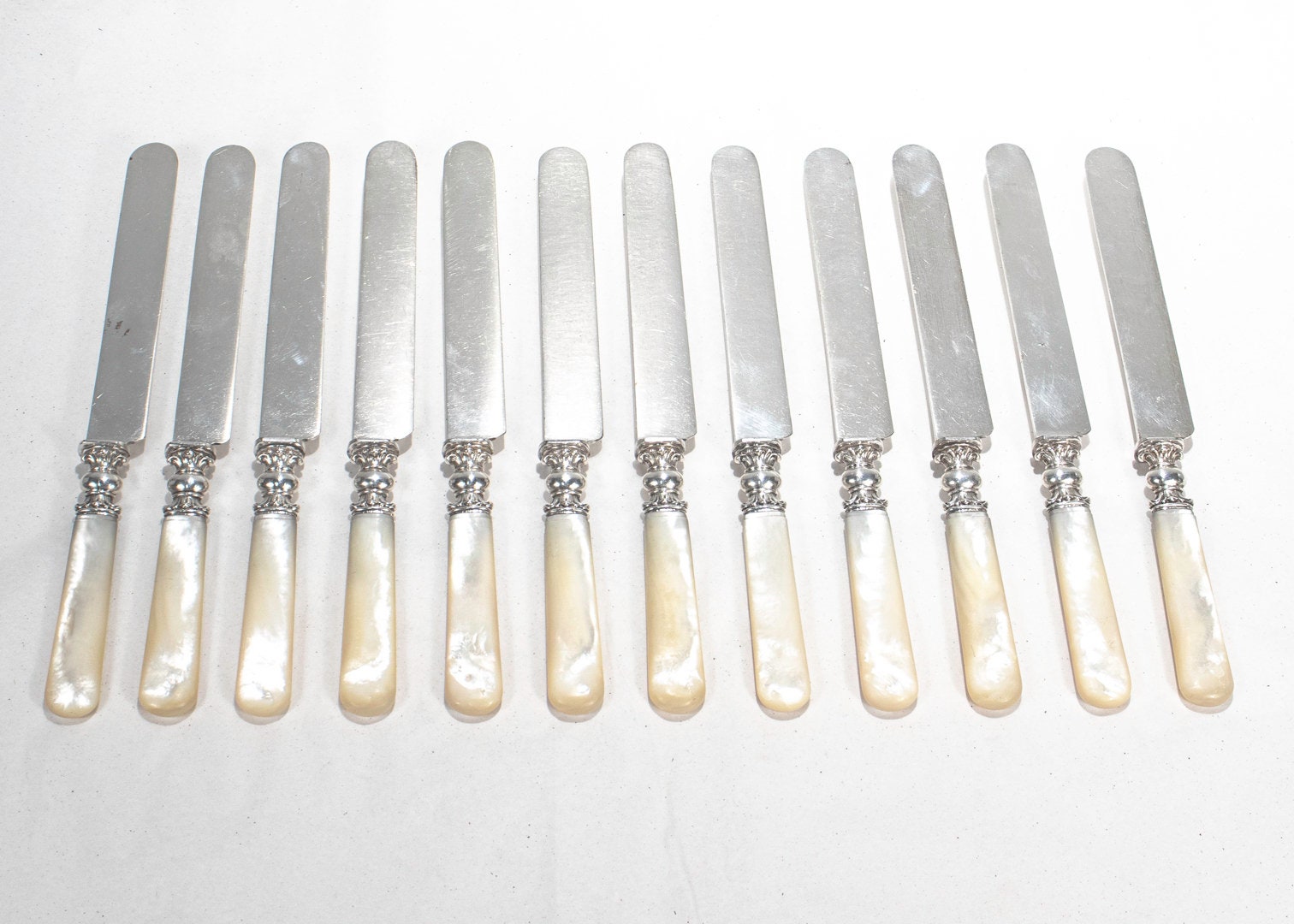 Complete Set of 12 Silver & Mother of Pearl Handled Dinner Knives