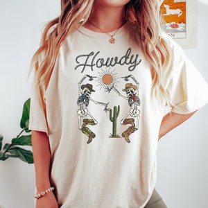 Howdy Skeleton Cowgirl T shirt, Western Graphic Shirt, Country Concert Outfit, Cowgirl Bachelorette Gift, Cowboy shirt, Rodeo Shirt, Yeehaw