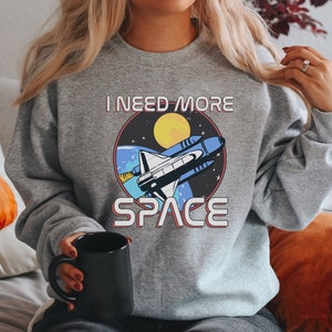I Need More Space Sweatshirt, Retro Spaceship Print Shirt, Funny NASA Astronaut Pullover, Outer Space Shuttle Crewneck, Galaxy Lover Shirt