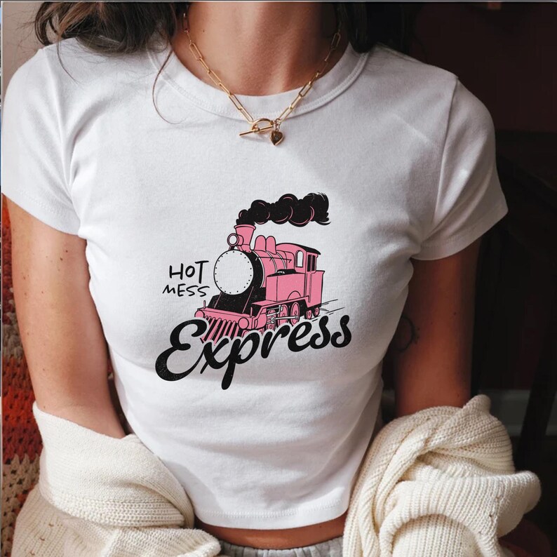 May include: White t-shirt with a pink and black train graphic and the text "Hot Mess Express".