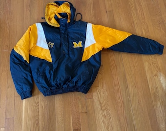 May include: A vintage Michigan Wolverines jacket in blue, yellow and white with a zip and a hood. The jacket features a large "M" on the front and the text "Jave 13" on the left side.