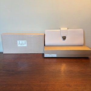Cartera vintage Alfred Dunhill de los años 50 para mujer, de piel de becerro color crema con cáscara de huevo, nueva