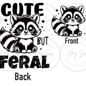 May include: Black and white raccoon graphic with the text "CUTE BUT FERAL" and "Front" and "Back". The raccoon has large eyes and a striped tail. The design is on a white background.
